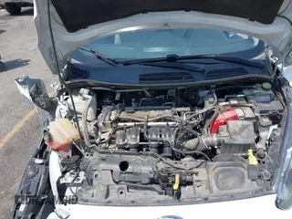 2018 Ford Fiesta SE z VIN 3FADP4EJ8JM141067, wystawiony jako IAAI lot #42417301 z przebiegiem 71 150 mil mil oraz . Historia ofert i sprzedaży dostępna na DreamBid. Obrazek 10.