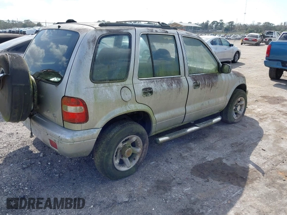 2001 Kia Sportage with VIN KNDJB723115706221, listed as a IAAI auction lot 41562713 with 99,378 mi miles. Bid and sale history available at carsss.com. Image 4.