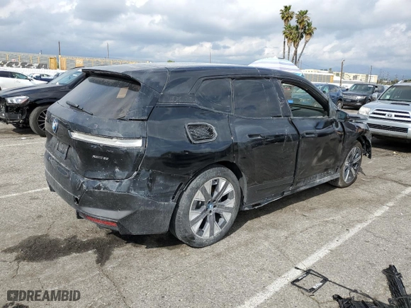 2025 BMW iX xDrive50 with VIN WB523CF00SCT18853, listed as a Copart auction lot 51282705 with 0 mi miles and Salvage Title. Bid and sale history available at carsss.com. Image 3.