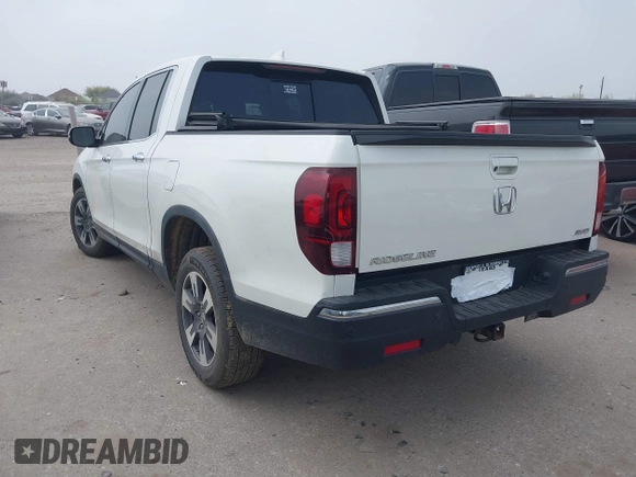 2018 Honda Ridgeline RTL-E with VIN 5FPYK3F77JB004379, listed as a IAAI auction lot 41802025 with 132,085 mi miles and . Bid and sale history available at DreamBid. Image 3.