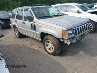 1994 Jeep Grand Cherokee Laredo with VIN 1J4GZ58Y1RC265589, listed as a IAAI auction lot 42142226 with 138,656 mi miles. Bid and sale history available at carsss.com. Image 1.