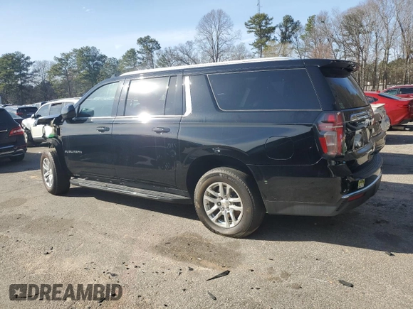 2023 Chevrolet Suburban LS with VIN 1GNSCBKD8PR163178, listed as a Copart auction lot 47844175 with 104,369 mi miles and Salvage Title. Bid and sale history available at DreamBid. Image 2.