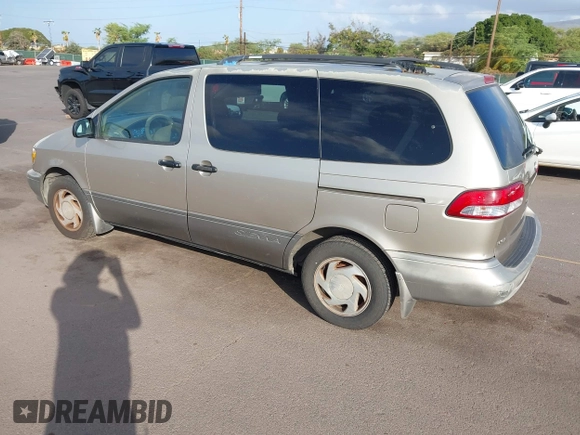 2002 Toyota Sienna LE with VIN 4T3ZF13C82U457803, listed as a IAAI auction lot 41198246 with 185,445 mi miles and . Bid and sale history available at DreamBid. Image 3.