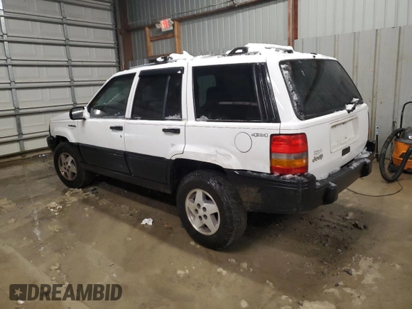 1995 Jeep Grand Cherokee Laredo with VIN 1J4GZ58S6SC630947, listed as a Copart auction lot 82143564 with 267,946 mi miles and Salvage Title. Bid and sale history available at carsss.com. Image 2.