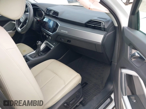 2022 Audi Q3 S line Premium Plus with VIN WA1EECF32N1065423, listed as a IAAI auction lot 42081354 with 27,071 mi miles and . Bid and sale history available at DreamBid. Image 5.