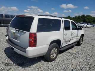 2013 Chevrolet Suburban LT with VIN 1GNSCJE0XDR146798, listed as a Copart auction lot 62408525 with 218,484 mi miles and Salvage title. Bid and sale history available at DreamBid. Image 3.