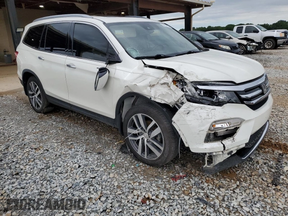 2017 Honda Pilot Touring z VIN 5FNYF6H92HB067140, wystawiony jako Copart lot #55757925 z przebiegiem 132 425 mil mil oraz Szkoda całkowita • Salvage title. Historia ofert i sprzedaży dostępna na DreamBid. Obrazek 4.