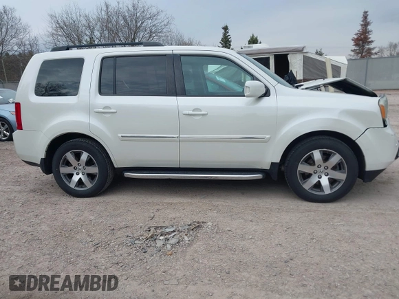 2014 Honda Pilot Touring with VIN 5FNYF4H91EB041614, listed as a IAAI auction lot 42050405 with 158,236 mi miles and . Bid and sale history available at DreamBid. Image 13.