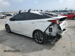 2021 Toyota Prius L Eco with VIN JTDKAMFUXM3149396, listed as a Copart auction lot 61874195 with 126,473 mi miles and Salvage title. Bid and sale history available at DreamBid. Image 2.