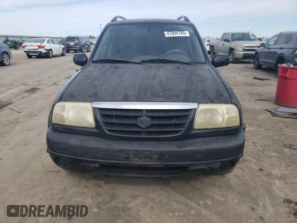 2003 Suzuki Grand Vitara z VIN JS3TE62V834101506, wystawiony jako Copart lot #47094765 z przebiegiem 240 778 mil mil oraz Szkoda całkowita • Salvage title. Historia ofert i sprzedaży dostępna na DreamBid. Obrazek 5.