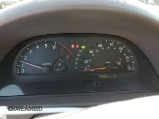 2004 Toyota Camry LE z VIN JTDBE32K640270298, wystawiony jako Copart lot #58800955 z przebiegiem 79 064 mil mil oraz Szkoda całkowita • Salvage title. Historia ofert i sprzedaży dostępna na DreamBid. Obrazek 9.
