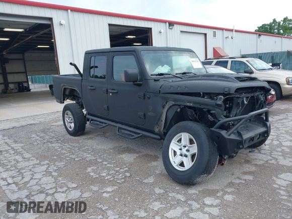 2021 Jeep Gladiator Sport S z VIN 1C6JJTAG9ML604950, wystawiony jako IAAI lot #39912720 z przebiegiem 34 640 mil mil oraz . Historia ofert i sprzedaży dostępna na DreamBid. Obrazek 1.