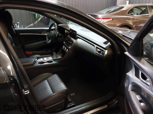2023 Genesis G70 2.0T with VIN KMTG34TA3PU115553, listed as a IAAI auction lot 41822917 with 35,784 mi miles and . Bid and sale history available at DreamBid. Image 5.