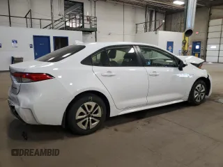 2021 Toyota Corolla Hybrid LE with VIN JTDEAMDE4MJ002382, listed as a Copart auction lot 50318865 with 74,385 mi miles and Salvage Title. Bid and sale history available at carsss.com. Image 3.