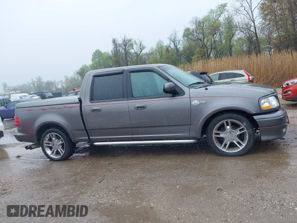 2002 Ford F-150 Harley Davidson with VIN 1FTRW07392KD29874, listed as a IAAI auction lot 41974230 with 163,279 mi miles. Bid and sale history available at carsss.com. Image 13.