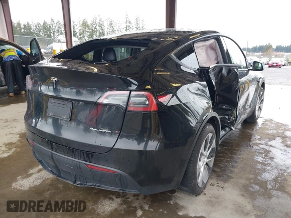 2023 Tesla Model Y Long Range with VIN 7SAYGAEE7PF739924, listed as a IAAI auction lot 41612323 with 75,226 mi miles and . Bid and sale history available at DreamBid. Image 4.