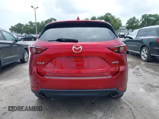 2018 Mazda CX-5 Grand Touring with VIN JM3KFADM5J0437365, listed as a IAAI auction lot 42657919 with 96,760 mi miles and . Bid and sale history available at DreamBid. Image 16.