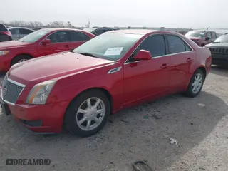 2009 Cadillac CTS RWD w/1SA with VIN 1G6DF577490135353, listed as a IAAI auction lot 41724476 with 128,062 mi miles. Bid and sale history available at carsss.com. Image 2.