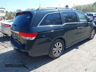 2014 Honda Odyssey EX-L with VIN 5FNRL5H68EB102286, listed as a IAAI auction lot 42148323 with 160,446 mi miles and . Bid and sale history available at carsss.com. Image 4.