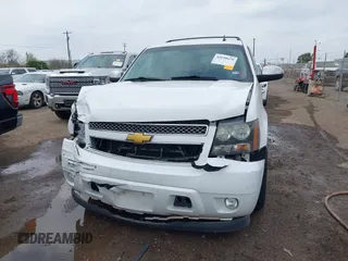 2014 Chevrolet Suburban LT with VIN 1GNSCJE04ER107836, listed as a IAAI auction lot 41698679 with 106,139 mi miles. Bid and sale history available at carsss.com. Image 6.