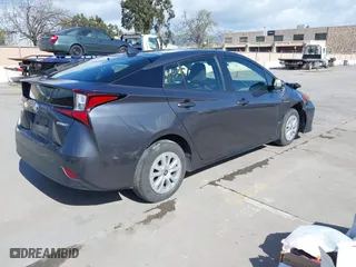 2022 Toyota Prius L Eco with VIN JTDKAMFU4N3177258, listed as a IAAI auction lot 39148811 with 50,902 mi miles. Bid and sale history available at carsss.com. Image 4.
