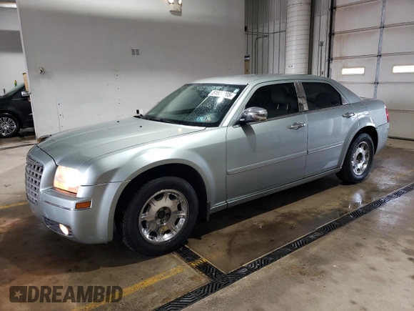 2005 Chrysler 300 with VIN 2C3JA53G65H556313, listed as a Copart auction lot 51839305 with 124,358 mi miles and Salvage Title. Bid and sale history available at carsss.com. Image 1.