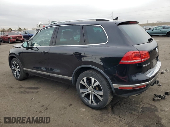 2017 Volkswagen Touareg Wolfsburg Edition with VIN WVGRF7BP9HD006520, listed as a Copart auction lot 84168634 with 76,596 mi miles and Salvage title. Bid and sale history available at DreamBid. Image 2.