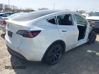 2024 Tesla Model Y with VIN 7SAYGDEDXRA300743, listed as a IAAI auction lot 41690374 with 12,446 mi miles and . Bid and sale history available at DreamBid. Image 4.