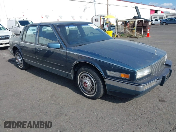 1986 Cadillac Seville z VIN 1G6KS6989GU813079, wystawiony jako IAAI lot #41732353 z przebiegiem Nie podano mil oraz . Historia ofert i sprzedaży dostępna na DreamBid. Obrazek 1.