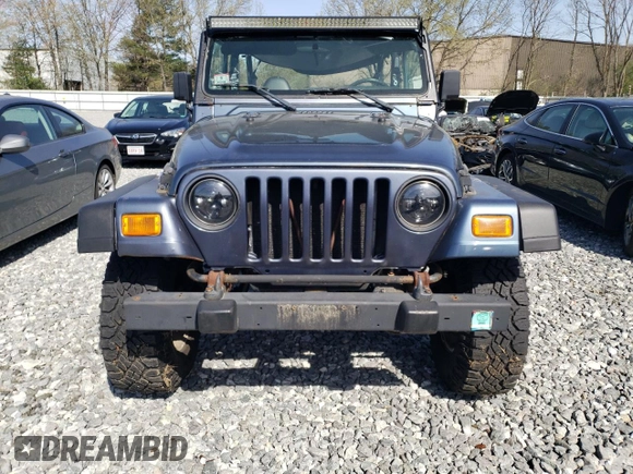 2002 Jeep Wrangler Sport with VIN 1J4FA49S92P715480, listed as a Copart auction lot 55157545 with 153,560 mi miles and Clean Title. Bid and sale history available at carsss.com. Image 5.