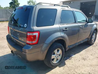 2012 Ford Escape XLT z VIN 1FMCU9DG7CKB28270, wystawiony jako IAAI lot #42607520 z przebiegiem 129 758 mil mil oraz . Historia ofert i sprzedaży dostępna na DreamBid. Obrazek 4.