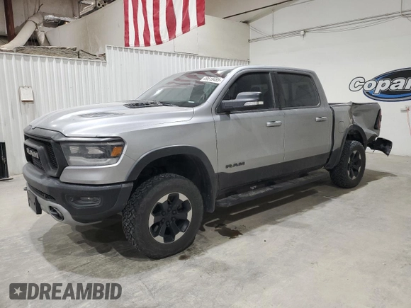2019 Ram 1500 Rebel z VIN 1C6SRFLT3KN671103, wystawiony jako Copart lot #49518485 z przebiegiem 134 232 mil mil oraz Czysty tytuł • Clean title. Historia ofert i sprzedaży dostępna na DreamBid. Obrazek 1.