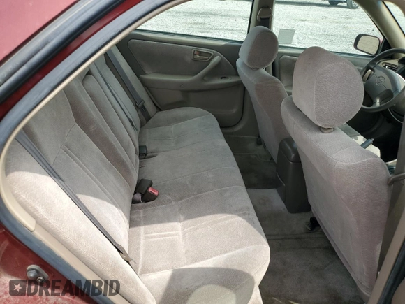 1999 Toyota Camry LE z VIN JT2BF22K8X0181675, wystawiony jako Copart lot #55057875 z przebiegiem 184 657 mil mil oraz Szkoda całkowita • Salvage title. Historia ofert i sprzedaży dostępna na DreamBid. Obrazek 10.