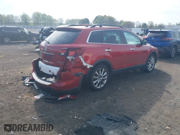 2015 Mazda CX-9 Grand Touring with VIN JM3TB3DA7F0448943, listed as a IAAI auction lot 41888414 with 104,052 mi miles. Bid and sale history available at carsss.com. Image 4.