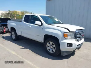 2015 GMC Canyon 2WD SLE z VIN 1GTH5BEA4F1239815, wystawiony jako IAAI lot #42135355 z przebiegiem 110 696 mil mil oraz . Historia ofert i sprzedaży dostępna na DreamBid. Obrazek 1.