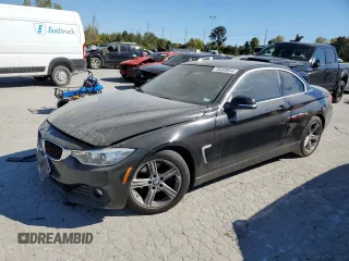 2014 BMW 4 Series 428i with VIN WBA3V7C54EJ872629, listed as a Copart auction lot 76668064 with 104,244 mi miles and Salvage title. Bid and sale history available at DreamBid. Image 1.