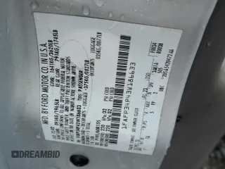 2003 Ford Focus SE z VIN 1FAFP34P43W186633, wystawiony jako Copart lot #56899065 z przebiegiem Nie podano mil oraz Szkoda całkowita • Salvage title. Historia ofert i sprzedaży dostępna na DreamBid. Obrazek 12.