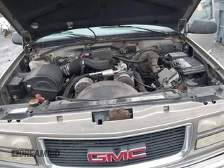 1999 GMC Yukon with VIN 1GKEK13R7XJ753243, listed as a IAAI auction lot 41231957 with 207,092 mi miles. Bid and sale history available at carsss.com. Image 10.