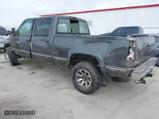 1999 GMC Sierra 2500 Crew Cab with VIN 1GTGK23R3XF050476, listed as a IAAI auction lot 41630143 with 158,655 mi miles. Bid and sale history available at carsss.com. Image 3.