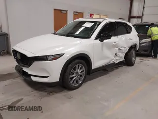 2020 Mazda CX-5 Grand Touring with VIN JM3KFBDM6L1828611, listed as a IAAI auction lot 42006976 with 59,939 mi miles and . Bid and sale history available at DreamBid. Image 18.
