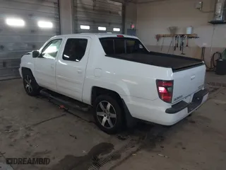 2014 Honda Ridgeline SE with VIN 5FPYK1F6XEB010582, listed as a IAAI auction lot 41641803 with 69,923 mi miles. Bid and sale history available at carsss.com. Image 3.