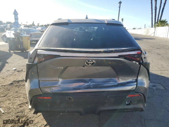 2024 Toyota bZ4X XLE with VIN JTMAAAAA0RA033070, listed as a Copart auction lot 85530044 with 6,818 mi miles and Salvage Title. Bid and sale history available at carsss.com. Image 6.