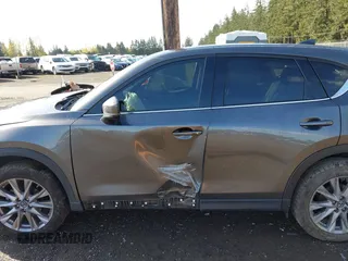 2019 Mazda CX-5 Grand Touring with VIN JM3KFBDM3K1677208, listed as a IAAI auction lot 41929299 with 58,163 mi miles. Bid and sale history available at carsss.com. Image 14.