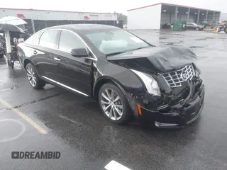 2013 Cadillac XTS Premium z VIN 2G61S5S39D9112491, wystawiony jako IAAI lot #42216373 z przebiegiem 145 338 mil mil oraz . Historia ofert i sprzedaży dostępna na DreamBid. Obrazek 1.