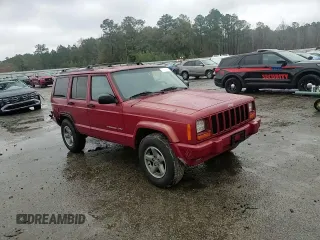 1999 Jeep Cherokee Sport with VIN 1J4FT68S1XL601799, listed as a Copart auction lot 83881844 with 203,572 mi miles and Salvage title. Bid and sale history available at DreamBid. Image 12.