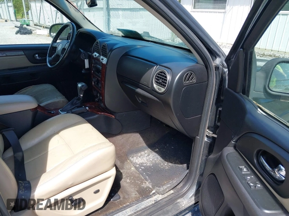 2007 GMC Envoy SLE with VIN 1GKDT13S372103718, listed as a IAAI auction lot 41886111 with 238,423 mi miles. Bid and sale history available at carsss.com. Image 5.