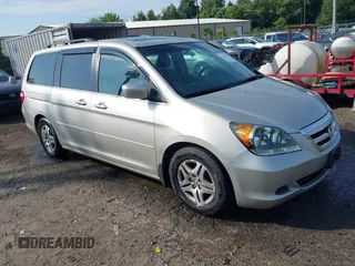 2005 Honda Odyssey EX-L with VIN 5FNRL38735B104802, listed as a IAAI auction lot 42740624 with 240,849 mi miles and . Bid and sale history available at DreamBid. Image 1.