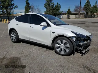 2022 Tesla Model Y Long Range with VIN 7SAYGDEE8NF551850, listed as a Copart auction lot 52747195 with 62,340 mi miles and Salvage Title. Bid and sale history available at carsss.com. Image 4.