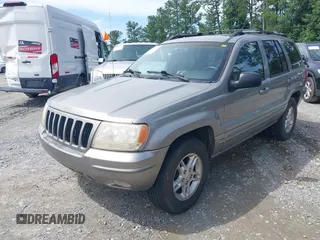 1999 Jeep Grand Cherokee Limited with VIN 1J4GW68N9XC808639, listed as a IAAI auction lot 42521785 with 156,864 mi miles and . Bid and sale history available at DreamBid. Image 2.