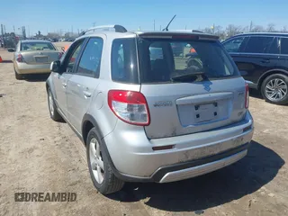 2009 Suzuki SX4 Touring AWD with VIN JS2YB417295100879, listed as a IAAI auction lot 41979405 with 69,625 mi miles and . Bid and sale history available at DreamBid. Image 3.
